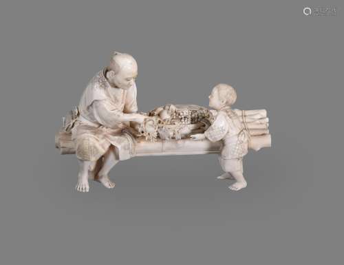 Y A Japanese Ivory Okimono of a farmer and his son