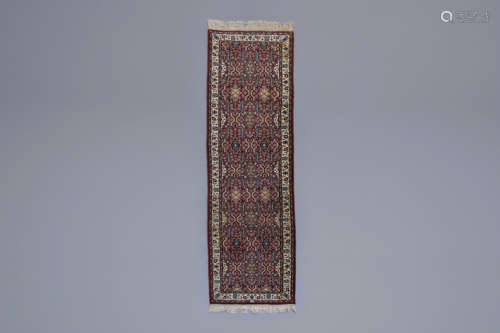 An Oriental runner with floral design, wool on cotton, 20th ...