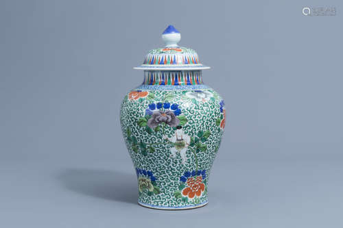 A Chinese wucai 'boys and peony scrolls' vase and cover, Wan...