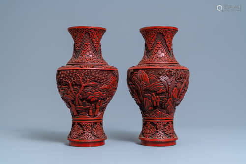 A pair of Chinese cinnabar lacquer vases with figures in a l...