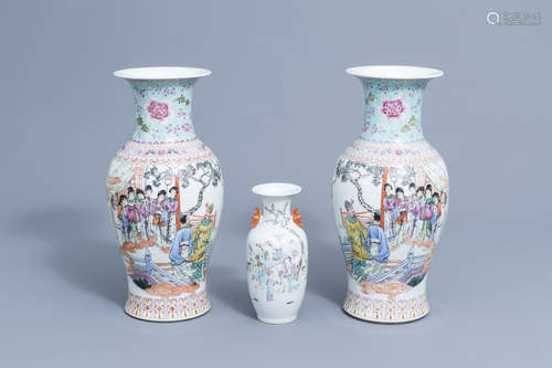 A pair of Chinese famille rose vases and a vase with figures...