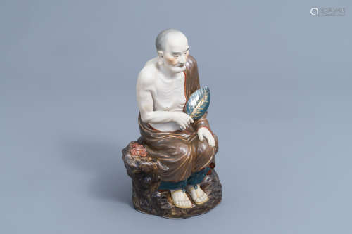 A Chinese Luohan figure in polychrome porcelain and biscuit,...