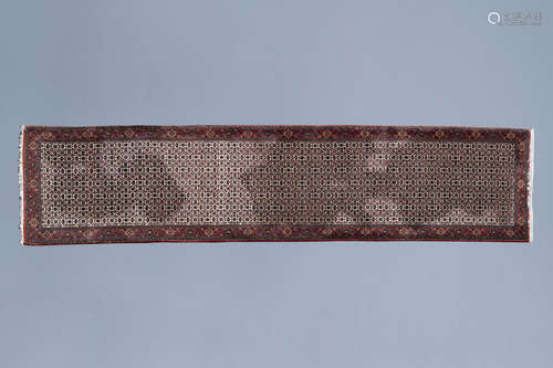 An Oriental Bidjar runner with floral design, wool on cotton...