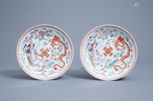 A pair of Chinese famille rose 'dragon and phoenix' chargers...