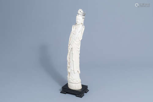 A large Chinese carved ivory figure of a lady on a wooden ba...