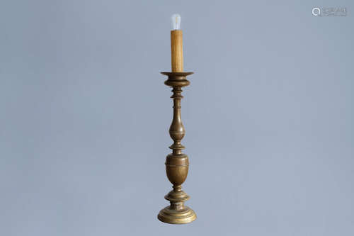 A large Italian bronze candlestick mounted as a lamp, 17th C...