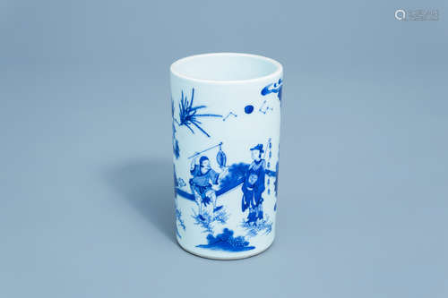 A Chinese blue and white brush pot with figures in a landsca...