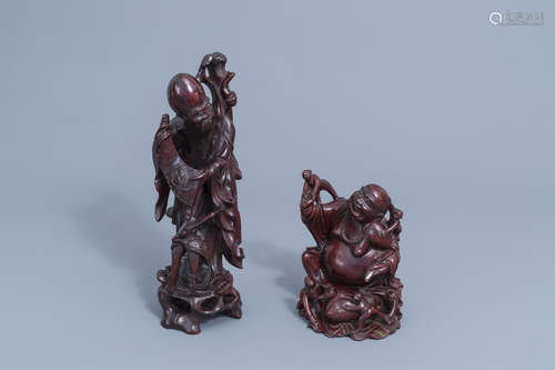 Two Chinese wooden figures of Shou Lao and a laughing Buddha...