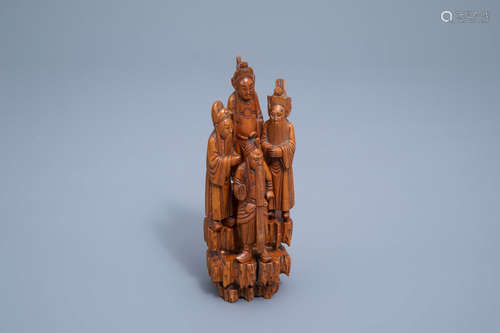 A Chinese carved wooden group with four figures, 19th/20th C...