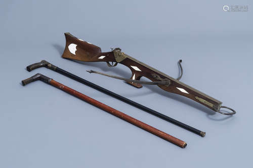 A French Druell(e) crossbow, Douai, and two walking sticks, ...