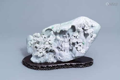 An impressive Chinese jadeite carving with figures in a land...