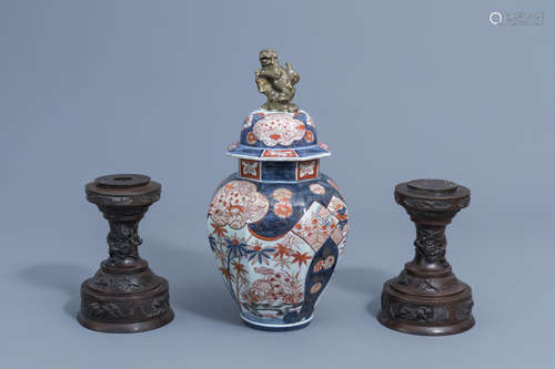 A Japanese Imari vase and cover and a pair of bronze stands ...