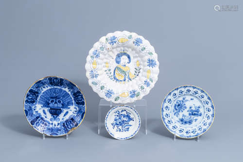 A Dutch Delft polychrome gadrooned dish and three blue and w...