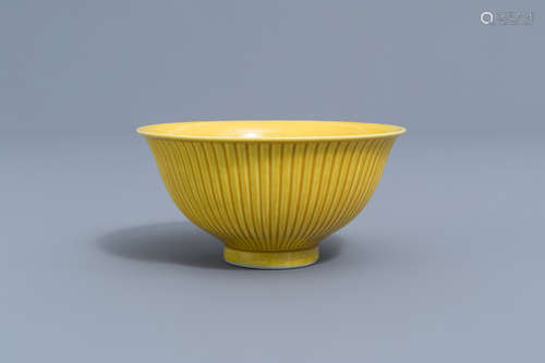 A ribbed Chinese monochrome yellow bowl, Yongzheng mark, 19t...