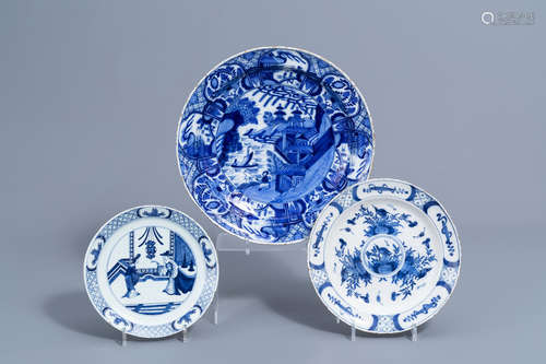 A Dutch Delft blue and white charger and two plates with chi...