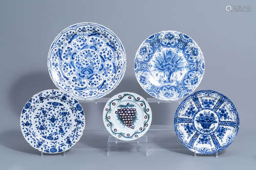 Four Dutch Delft blue and white chargers and a polychrome pl...