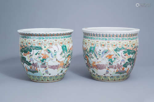 A pair of Chinese famille verte 'warrior' fish bowls, 20th C...