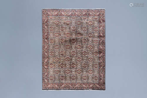 An Oriental Bidjar rug with floral design, wool and silk on ...