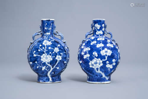 A pair of Chinese blue and white 'prunus flower' moon flask ...