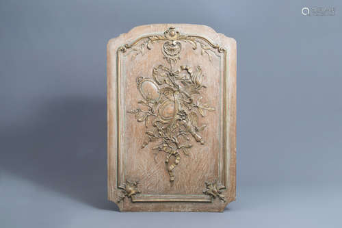 A French carved wooden Louis XV panel with ribbons and acant...