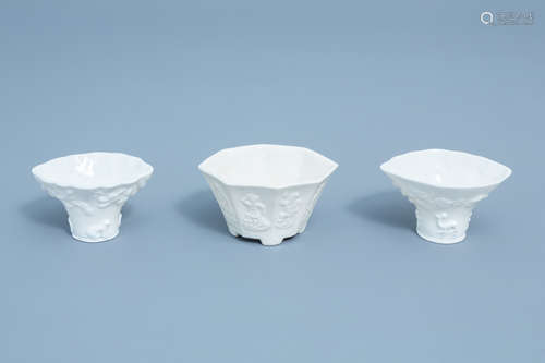 Three Chinese Dehua blanc de Chine cups with molded design, ...