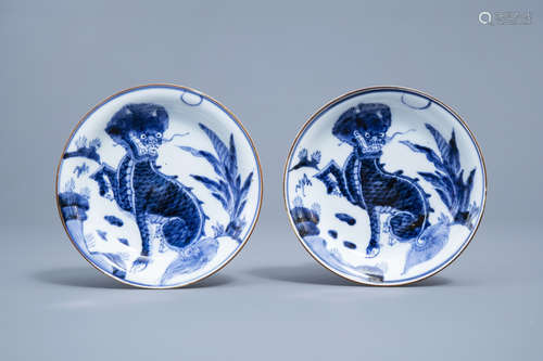 A pair of Japanese blue and white 'komainu' saucer dishes, m...