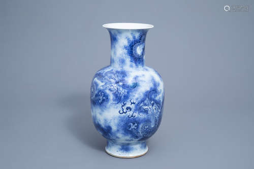 A Chinese blue and white baluster vase with dragons chasing ...