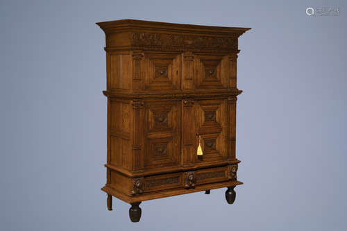 A Dutch carved oak four-door cupboard, 17h C. and later