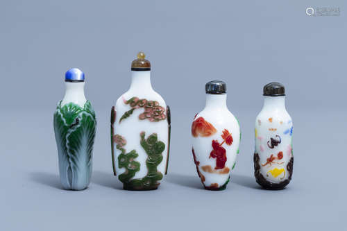 Eight Chinese overlay glass snuff bottles, 20th C.