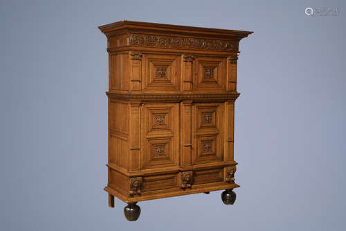 A Dutch carved oak four-door cupboard, 17h C. and later