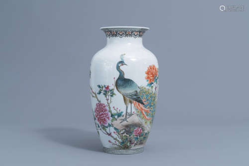 A Chinese famille rose vase with a peacock among blossoming ...