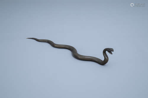 A Japanese bronze sculpture of a snake in an attack position...