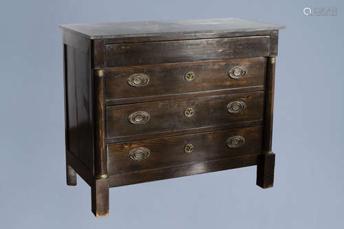 A French wooden Empire style chest of drawers with marble to...