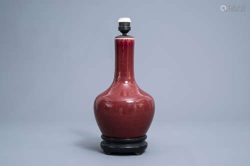 A Chinese monochrome sang de boeuf lamp-mounted bottle vase,...