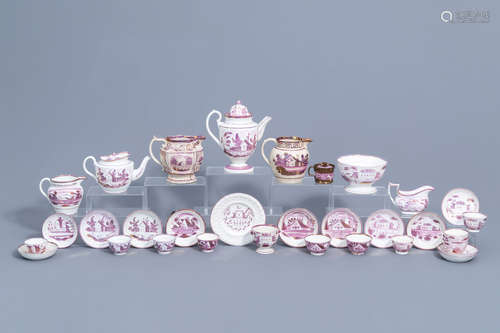 A varied collection of English pink lustreware items with a ...