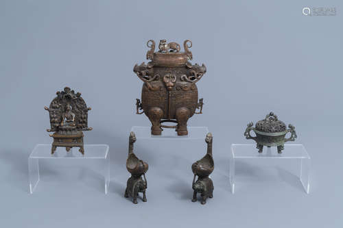 A bronze censer, a covered vase, a votive shrine and two rit...