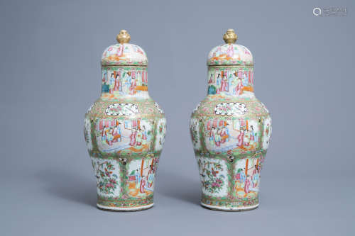 A pair of Chinese Canton famille rose vases and covers, 19th...