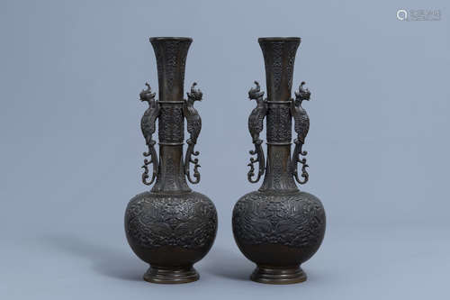 A pair of large Chinese bottle shaped bronze 'phoenixes' vas...