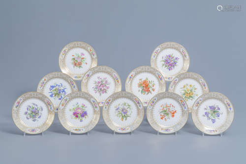 A set of eleven French plates with gilt and polychrome flora...