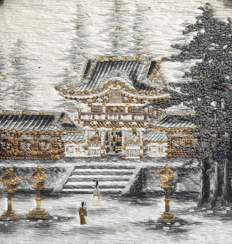 A Japanese silk embroidery with a temple in a lacquered and ...