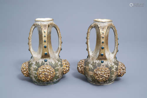 A pair of polychrome, gilt and iridescent Amphora Austria Ar...