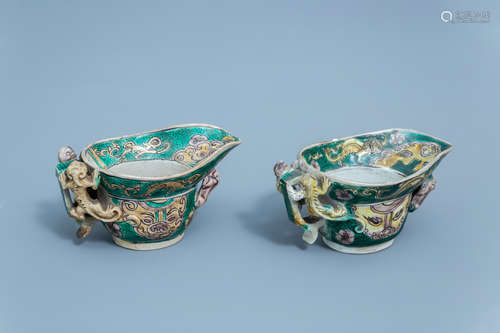 A pair of Chinese verte biscuit libation cups, Kangxi