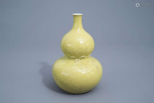 A Chinese monochrome yellow double gourd vase, Qianlong mark...