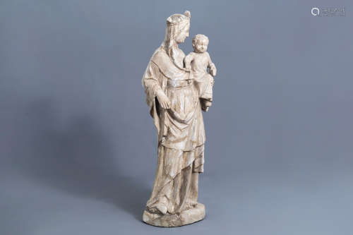 An impressive stone ële-de-France type Madonna and Child wit...