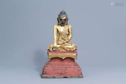 A large gilt, lacquered and polychrome Buddha with inlay, Bu...