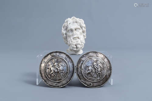 A pair of silver 'horseman' belt buckles and a marble head, ...