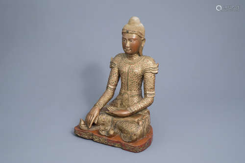 A tall inlaid gilt wood figure of a seated Buddha, Burma or ...