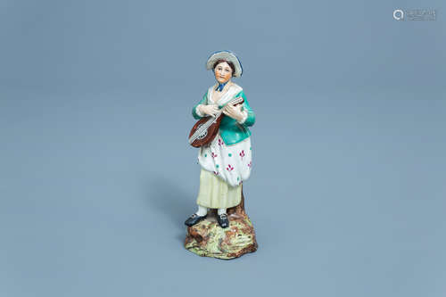 A German polychrome decorated earthenware figure of a lady w...