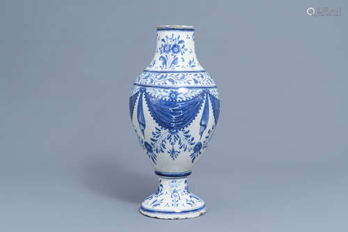 A Spanish blue and white pharmacy jar with floral design, Ta...