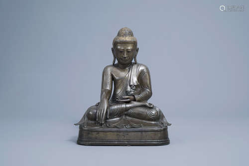 A large patinated and gilt bronze Buddha figure, Burma, Mand...